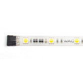 A white LED strip featuring the acronym WAC illuminated on its surface.